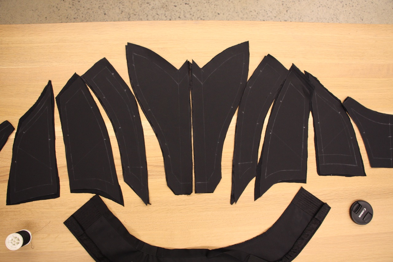 pieces of a deconstructed bodice laid out on work surface